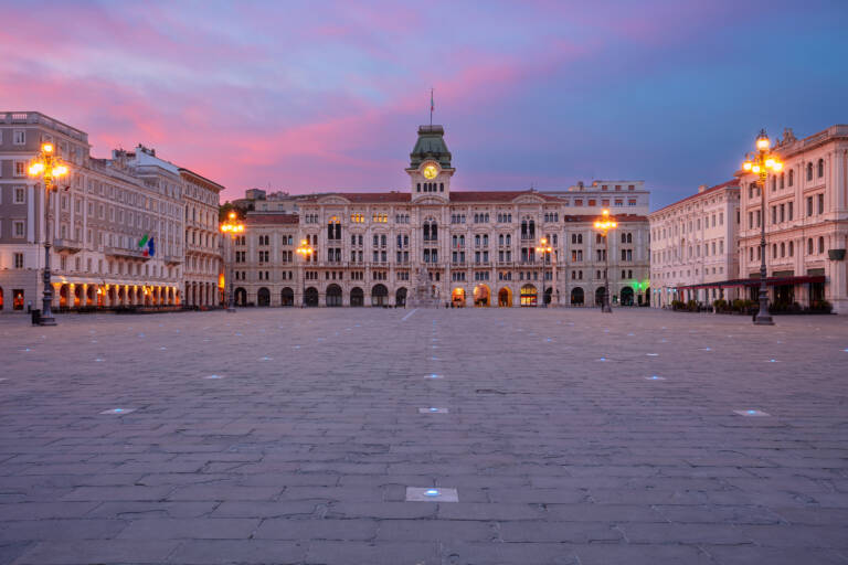 Trieste, Italy. Cityscape image of downtown Trieste, Italy with main square at dramatic sunrise.